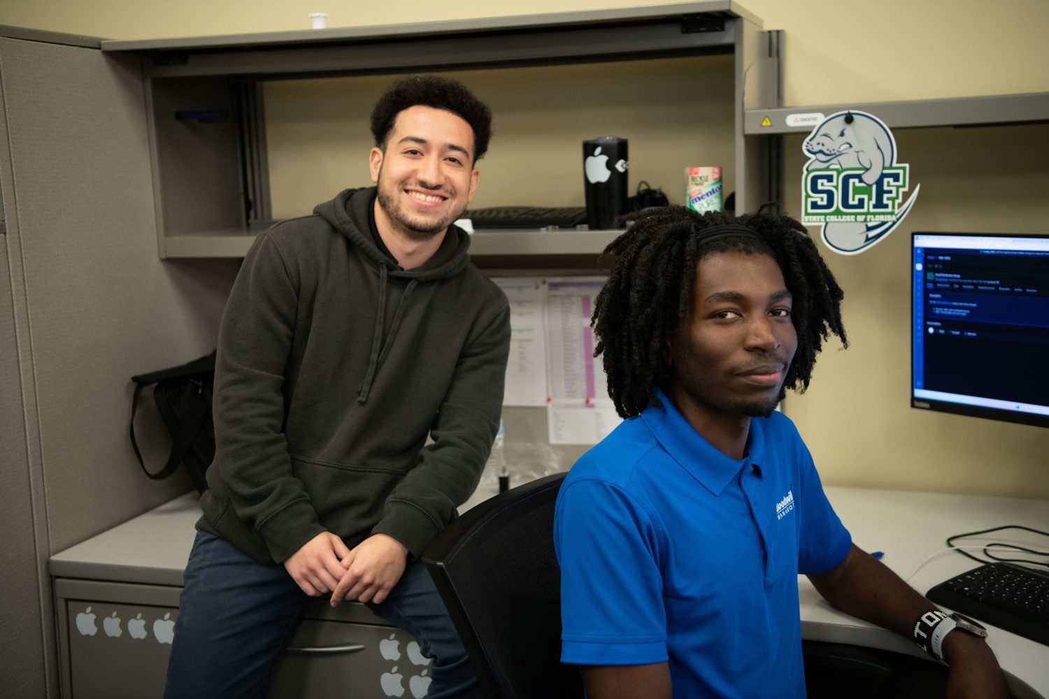 Goodwill Manasota Desktop Support Technician Altone Wasike (right), who has benefited from Goodwill’s Pursuit of Education program, with co-worker Jorge Abdul Hernandez Provided photo/Goodwill Manasota