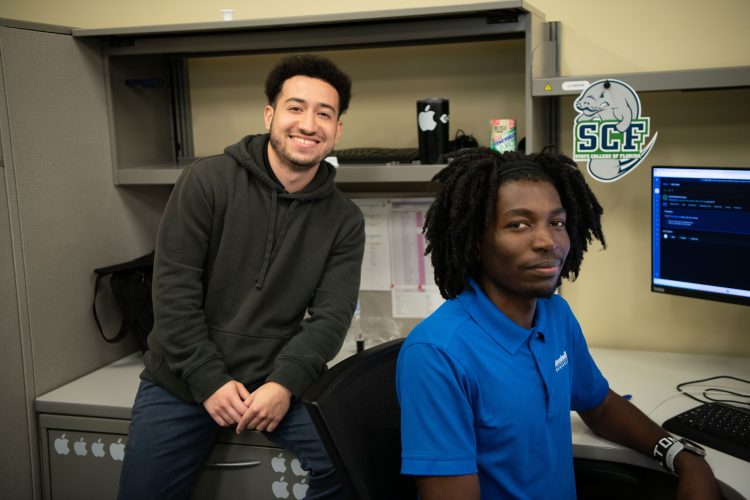 Goodwill Manasota Desktop Support Technician Altone Wasike (right), who has benefited from Goodwill’s Pursuit of Education program, with co-worker Jorge Abdul Hernandez Provided photo/Goodwill Manasota
