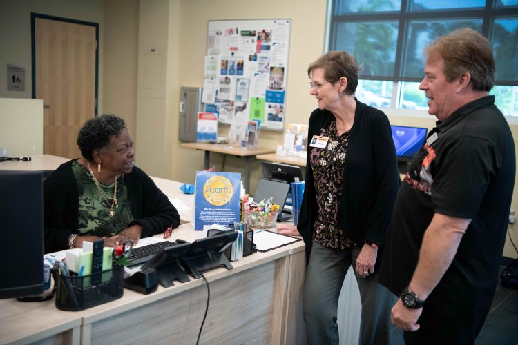 Goodwill team members Dorothy Mills, Margie Genter, and Randy Wright celebrating CARF accreditation.