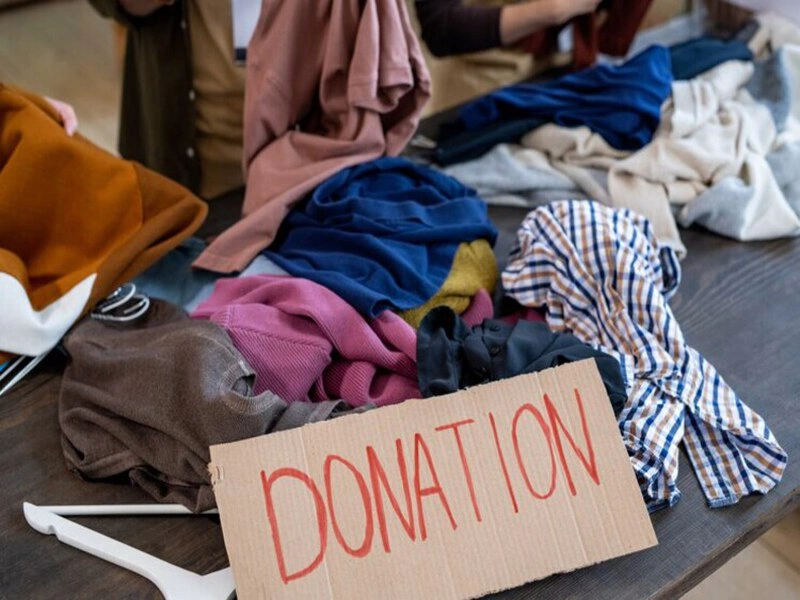 Person making clothing donations at a Boca Raton donation center