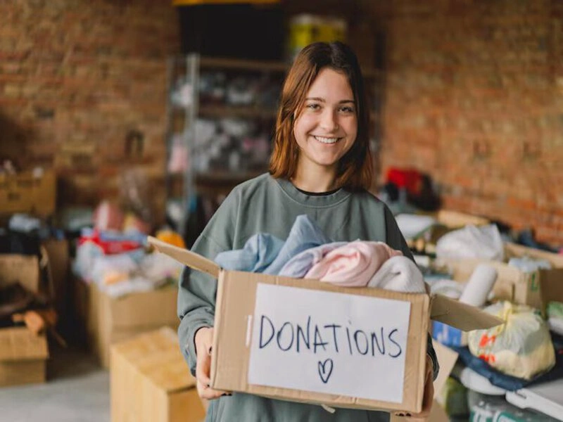 Volunteer collecting clothing donations in Boynton Beach