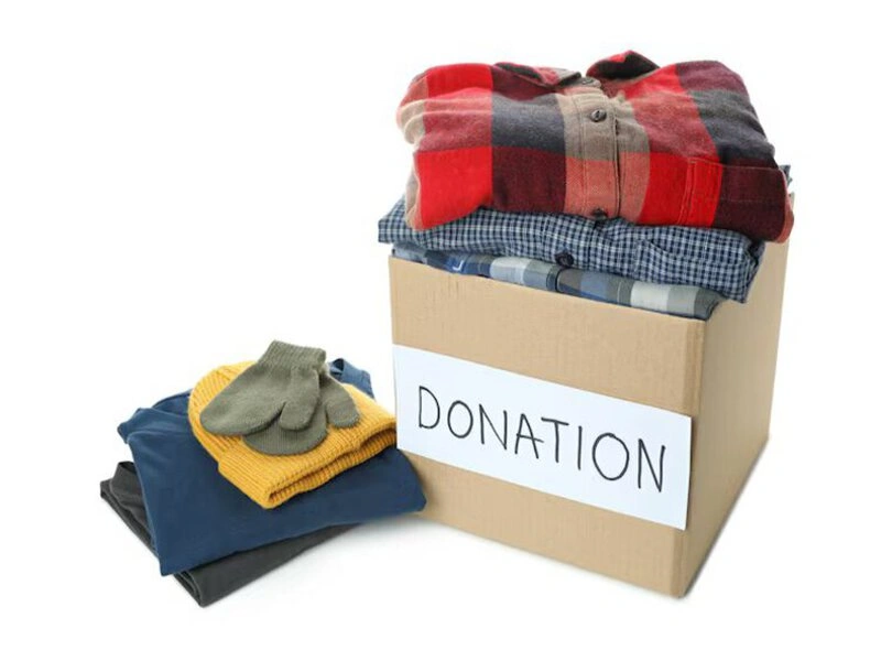 Volunteer accepting Goodwill clothing donation Volunteer accepting Goodwill clothing donation