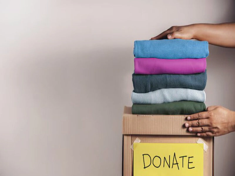 Stack of folded clothes prepared for clothing donations