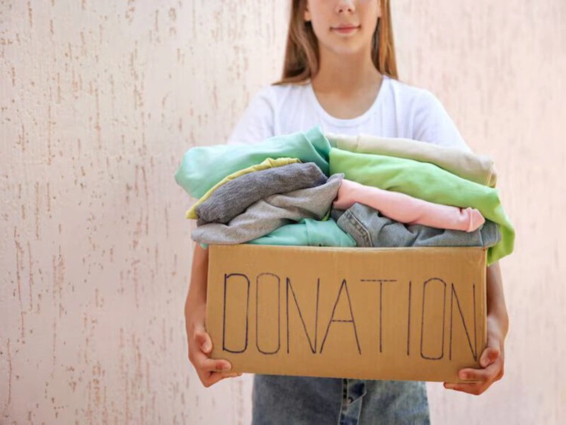 Families participating in used clothes donation Families participating in used clothes donation