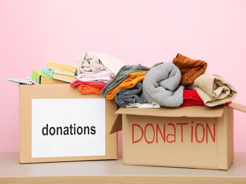 Packed boxes of used clothes ready for donation