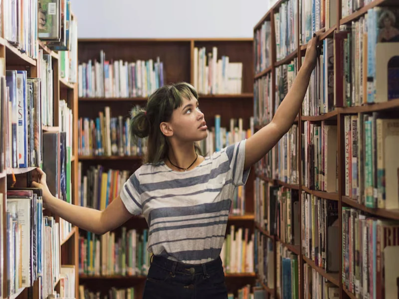 aisle of secondhand books at a goodwill bookstore in west palm beach with organized shelves