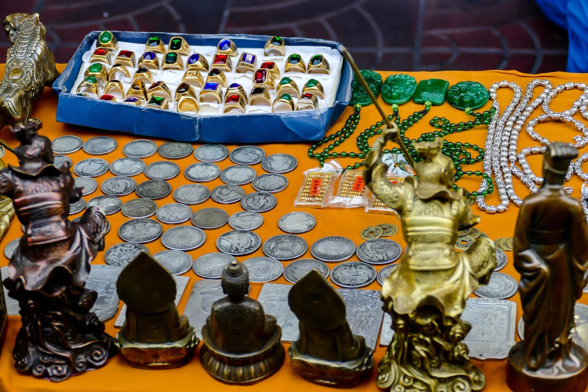 antique collection of coins and jewelry