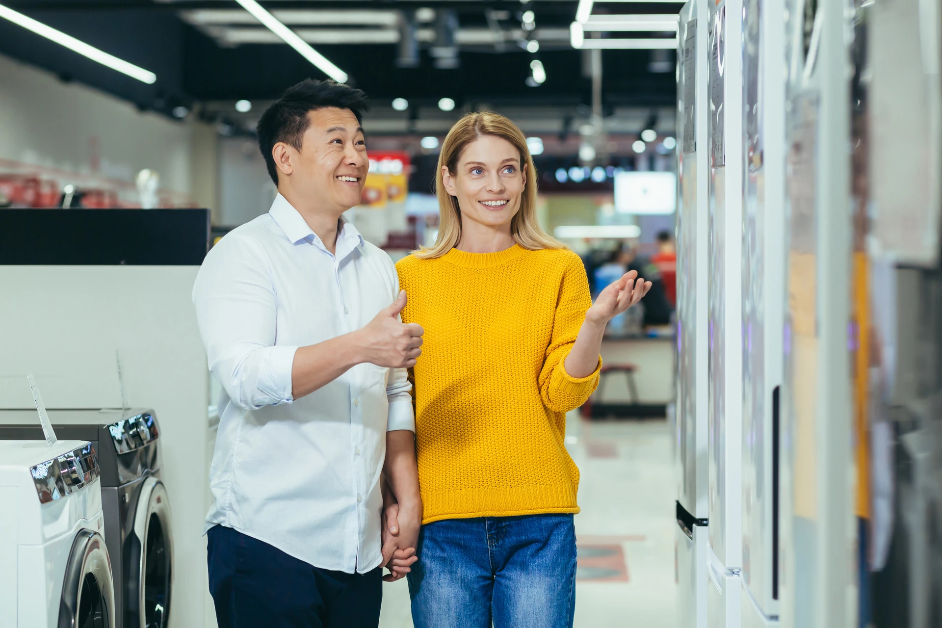 couple choosing appliances in a store