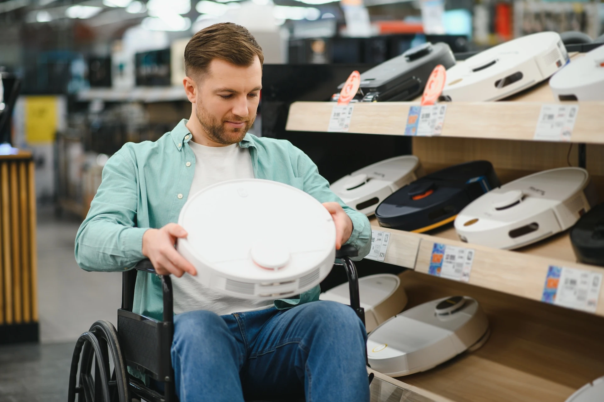 customer choosing vacuum cleaner in west palm beach goodwill
