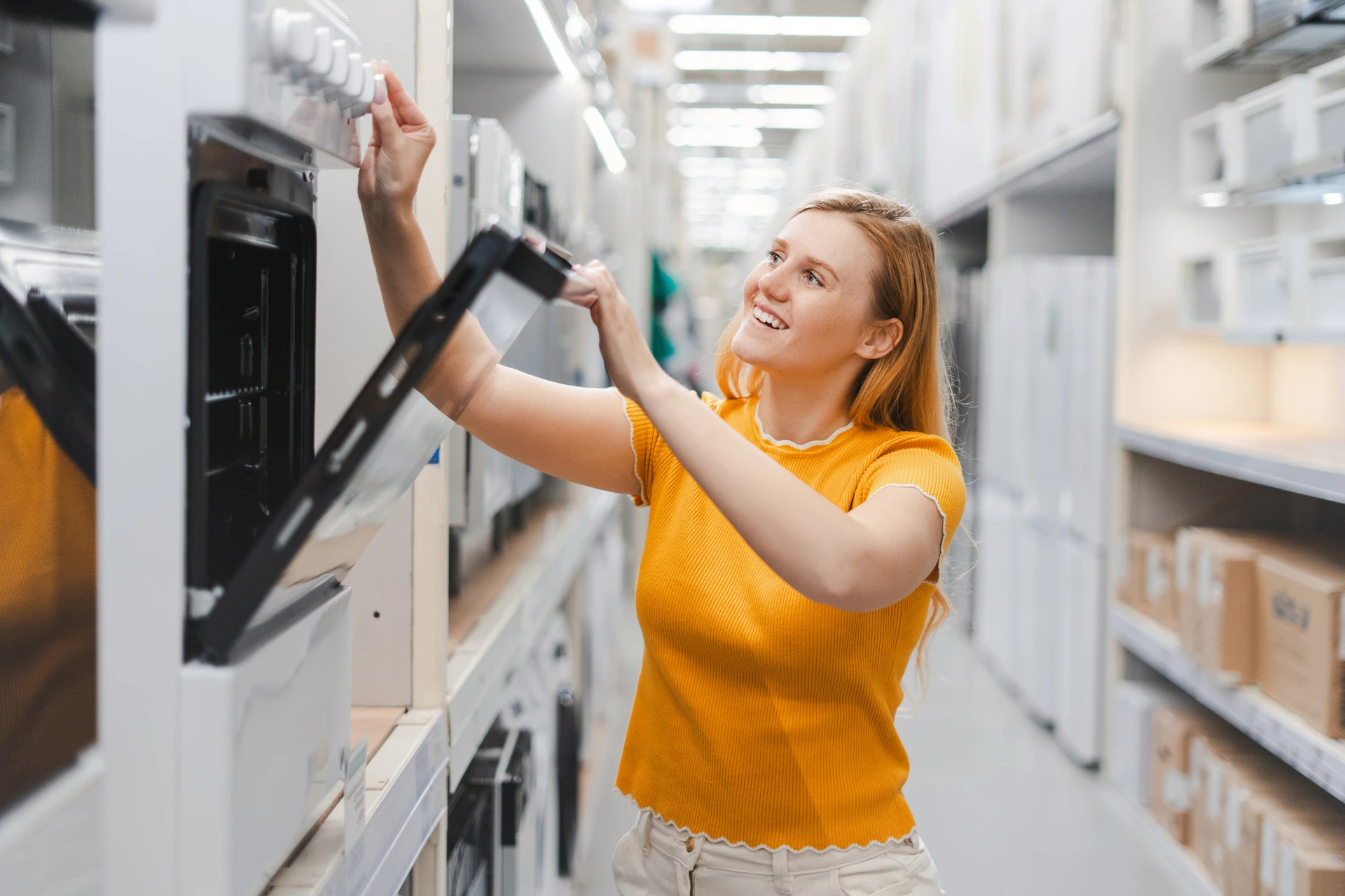 woman choosing used appliances for home
