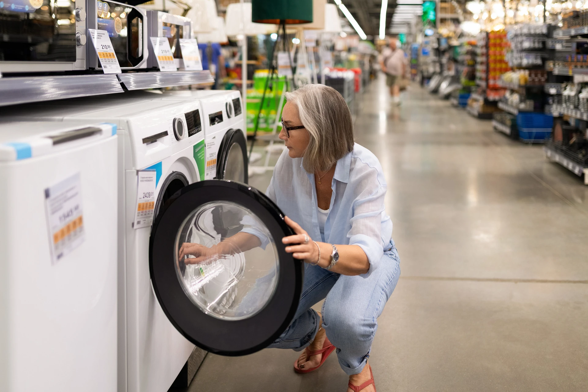 woman exploring second hand appliances in store