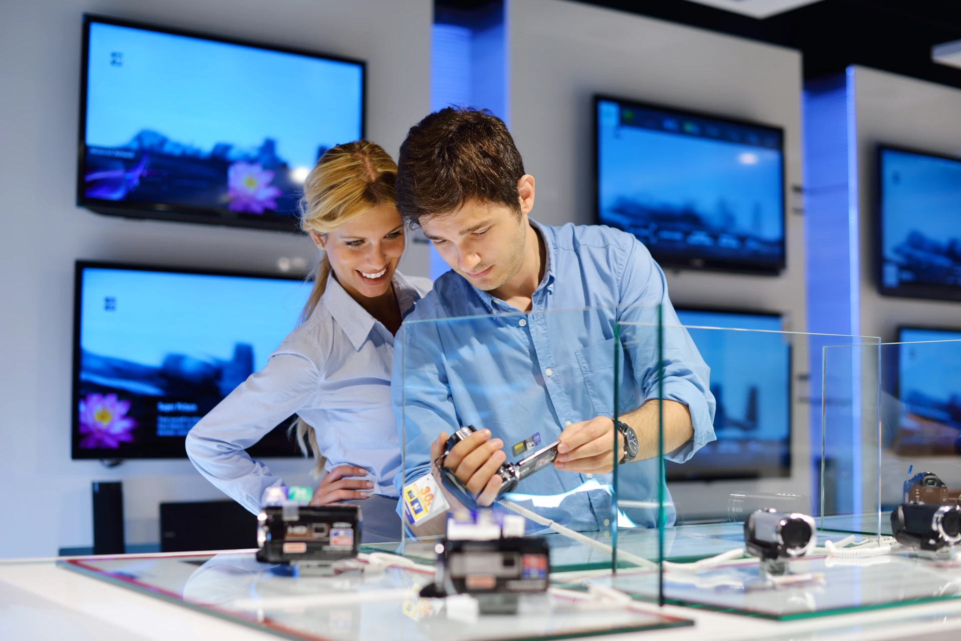 couple browsing electronics and gadgets at goodwill electronics in sarasota store