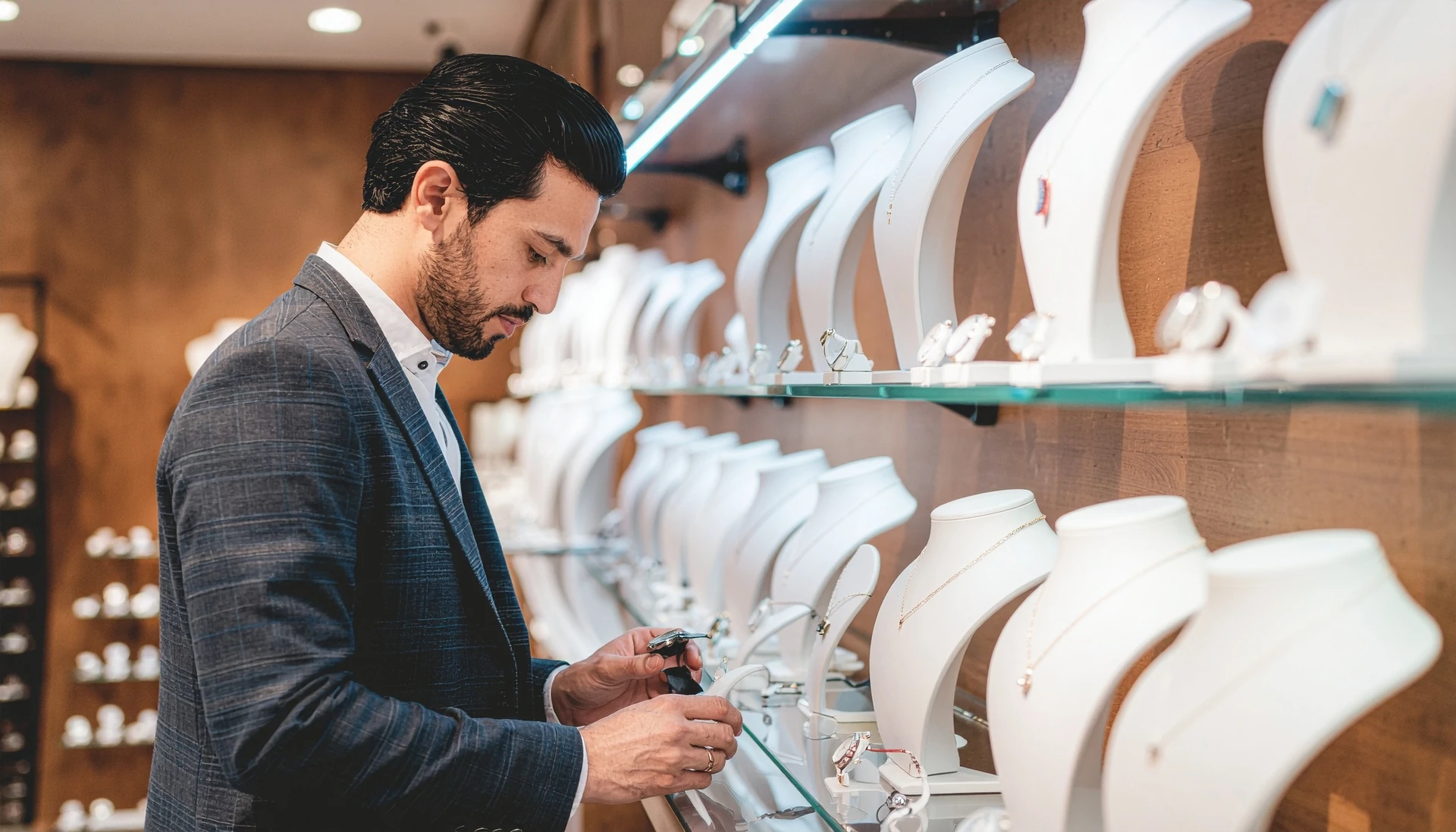 gold and silver pendant showcased in used jewelry store in bradenton