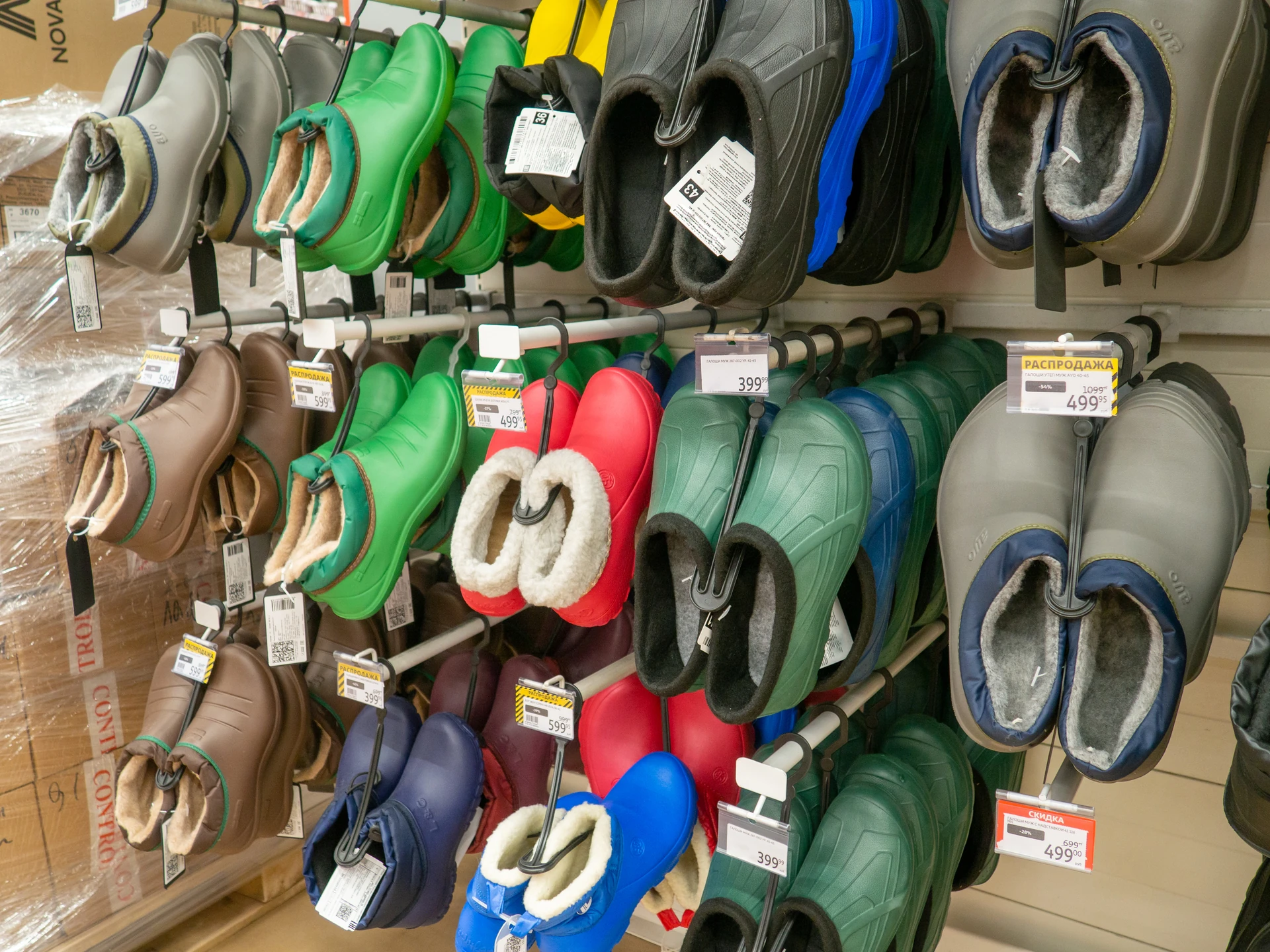 vintage and everyday shoe pairs arranged side by side on a thrift store display