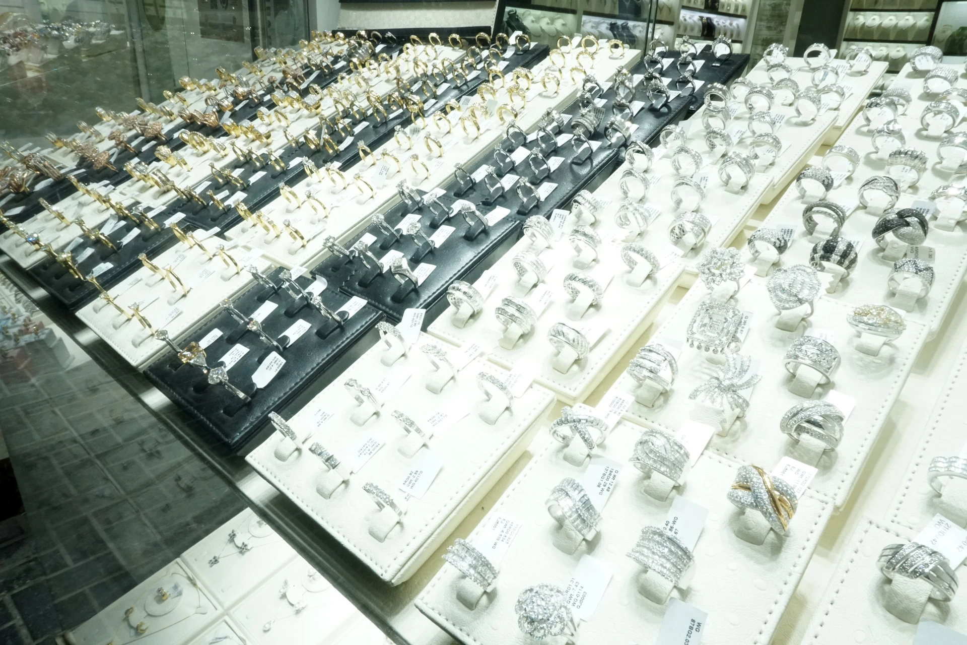 vintage rings grouped together as used jewelry for sale on a tray