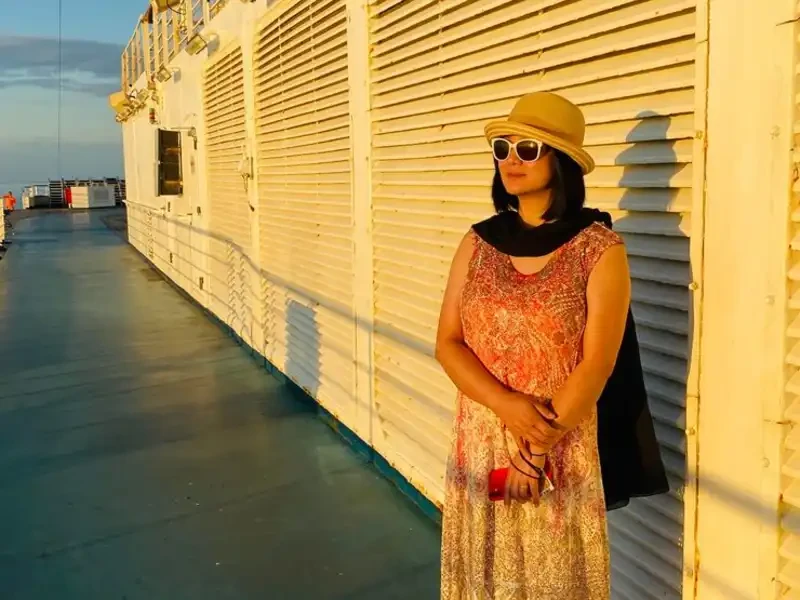 woman showcasing modern wearing outside of second hand clothing store
