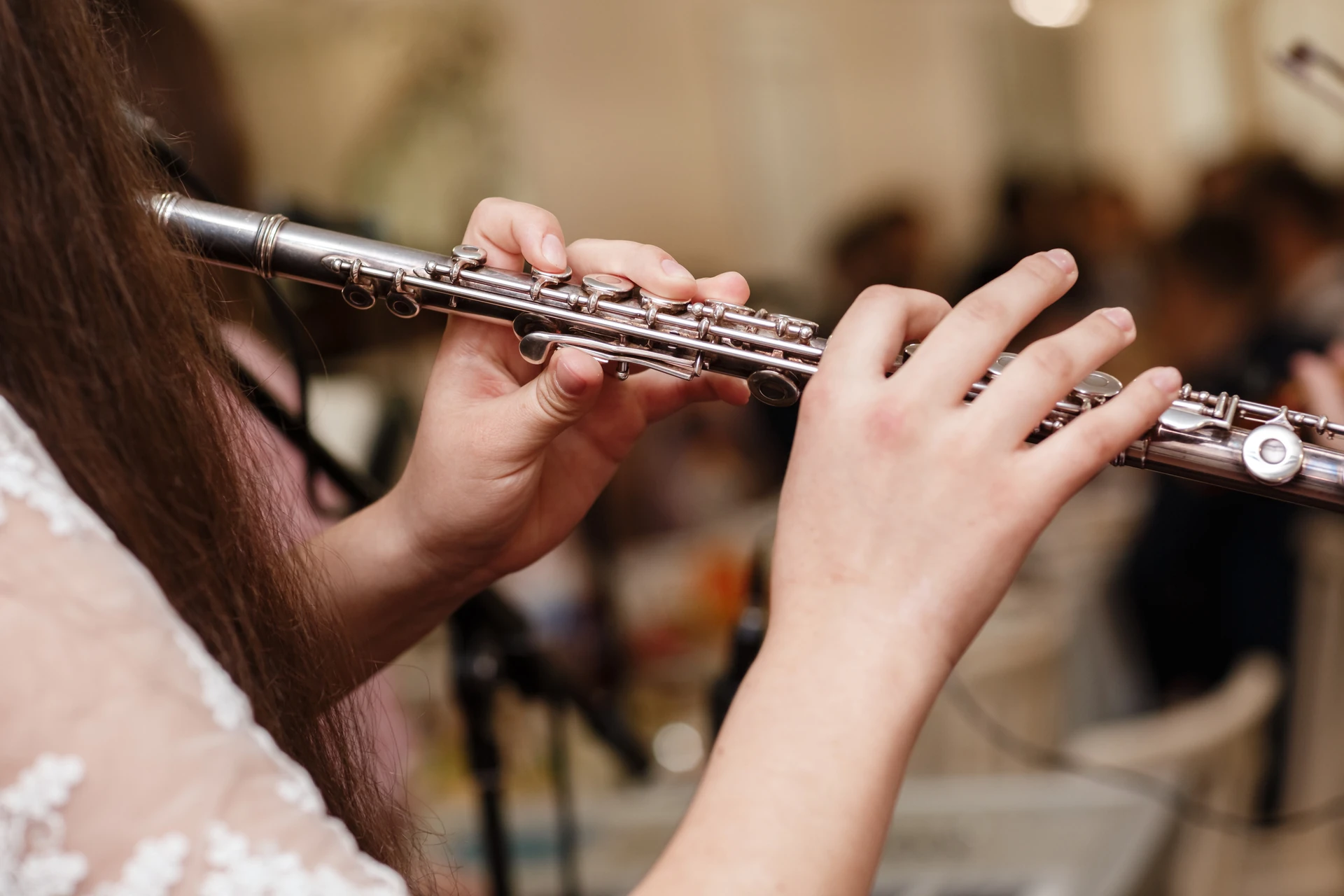 young girl testing flute showcased at goodwill boynton beach