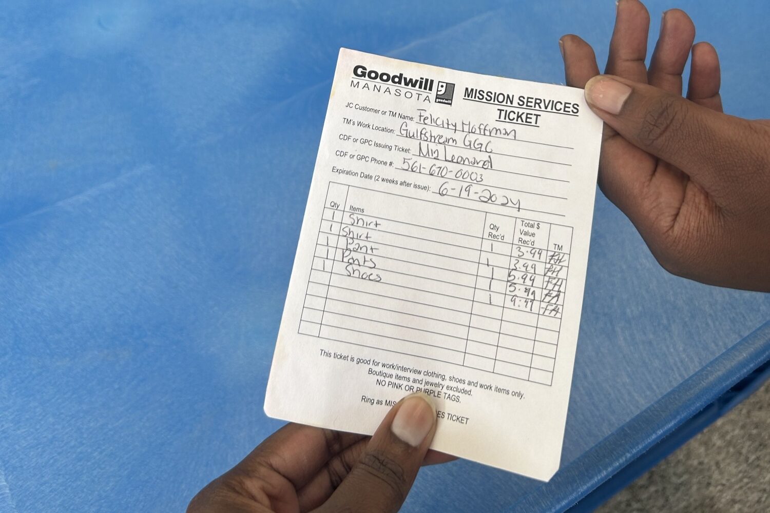 A Goodwill Mission Services ticket for work clothing